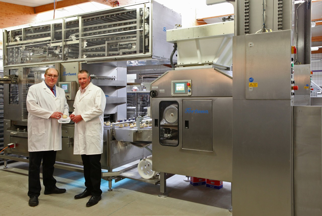 two-manager-in-front-of a- bakery-machine.jpg