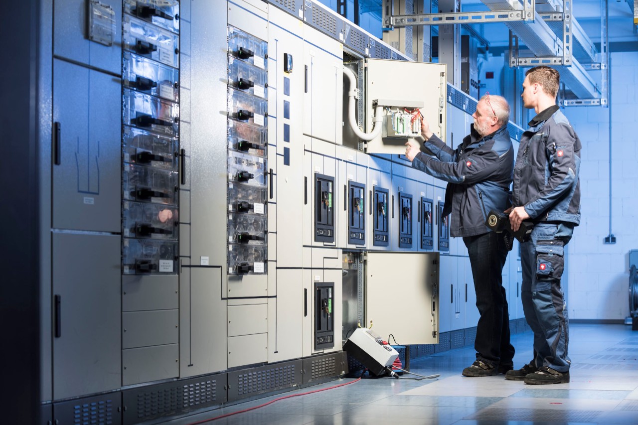 two-technicians-maintenance-panelboard.jpg